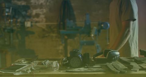 Workshop Focus on Tools and Safety Gear with Worker