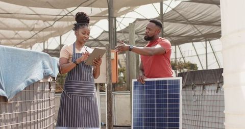 Coworkers innovating solar panel technology in agriculture