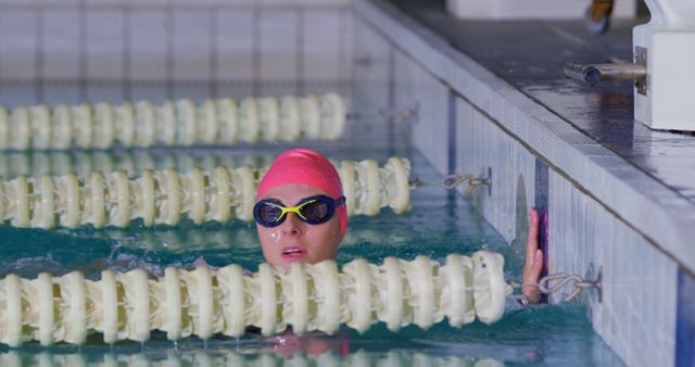 Female Swimmer Training in Indoor Pool with Lane Dividers - Download Free Stock Photos Pikwizard.com