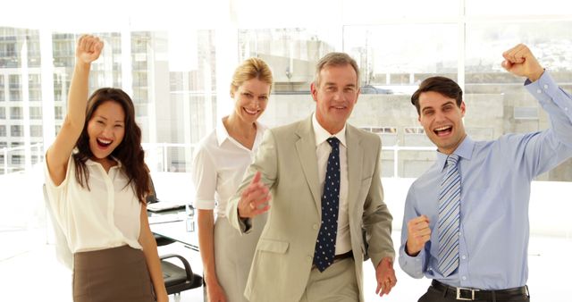 Team Celebrating Success in Modern Office - Download Free Stock Images Pikwizard.com