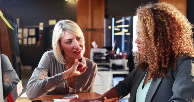 Professional Women Collaborating in Office Meeting - Download Free Stock Images Pikwizard.com