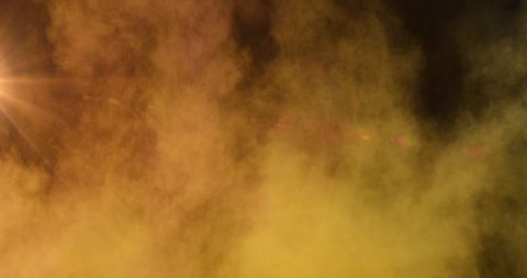 Vibrant Orange and Yellow Powder Explosion with Light Glow Effects - Download Free Stock Images Pikwizard.com