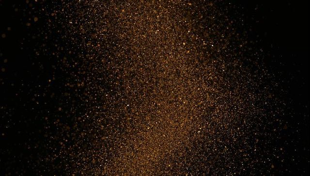 Shimmering Gold Particles Creating Elegant Cosmic Effect