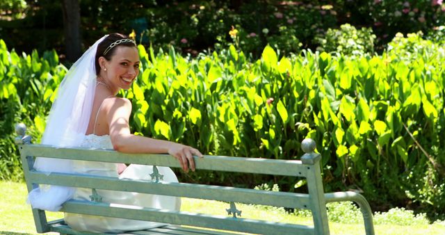 Joyful Bride Relaxing on Park Bench in Sunlit Garden - Download Free Stock Images Pikwizard.com