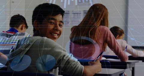 Smiling Teen Turning in Classroom with Digital Charts Overlay Showing Tech-Driven Learning