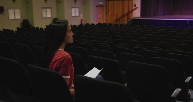 Woman Sitting Alone in an Empty Auditorium - Download Free Stock Images Pikwizard.com