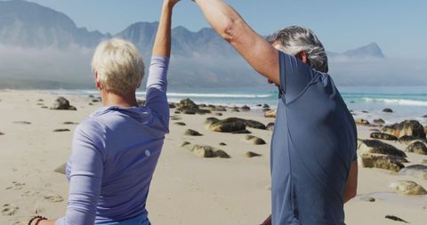 Senior Couple Dancing on Rocky Beach Outdoors in Nature - Download Free Stock Images Pikwizard.com