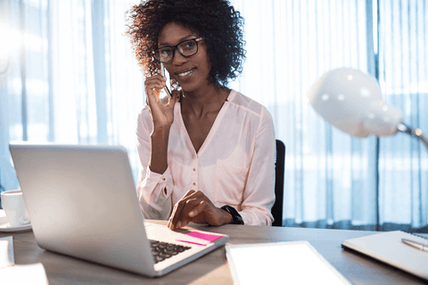 Confident Professional Woman on Phone in Contemporary Office Setting