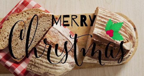 Rustic christmas bread loaves on wooden board featuring merry christmas text overlay