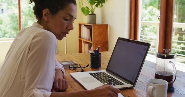 Focused Woman Working at Home Office Desk with Laptop - Download Free Stock Images Pikwizard.com