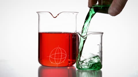 Science Experiment with Colored Liquids in Beakers