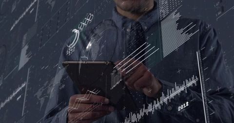 Executive holding tablet analyzing holographic dashboards and financial data visualization
