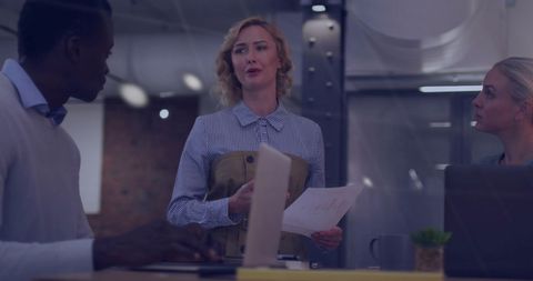 Diverse Business Meeting In Corporate Office With Financial Data Overlay