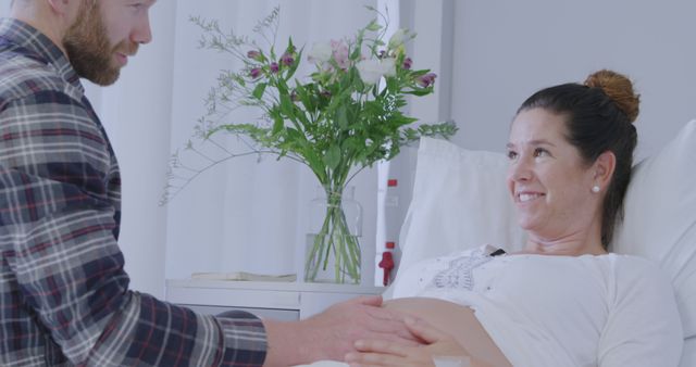 Excited Expectant Parents Bonding Over Future Child in Hospital Room - Download Free Stock Images Pikwizard.com