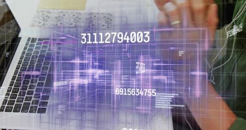 Chinese man typing on laptop with holographic numeric overlay, futuristic data analytics