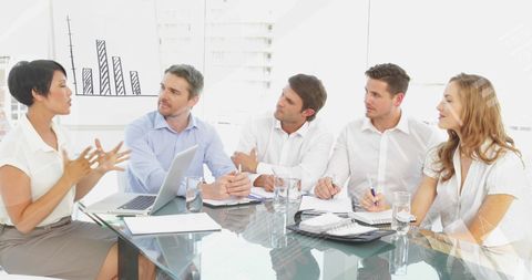 Diverse Team Collaborating on Business Reports with Infographic Overlay