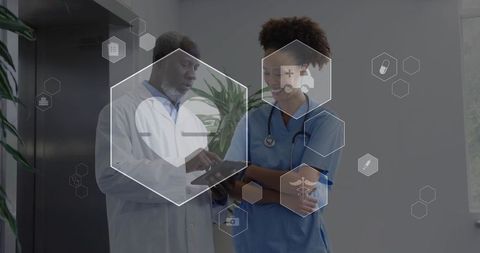 Doctor and nurse collaborating with tablet and digital health icons for clinical telemedicine