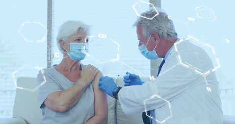 Doctor Administering Vaccine to Elderly Woman with Overlay of Medical Graphics