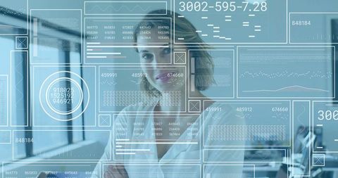Female executive interacting with futuristic hud analytics in modern glass office
