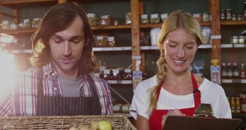 Happy Workers Organizing Fresh Produce in Rustic Market