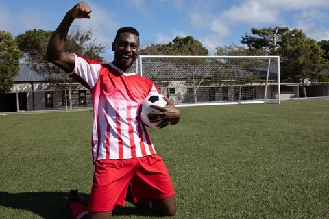 African American Soccer Player Celebrating Victory on Field