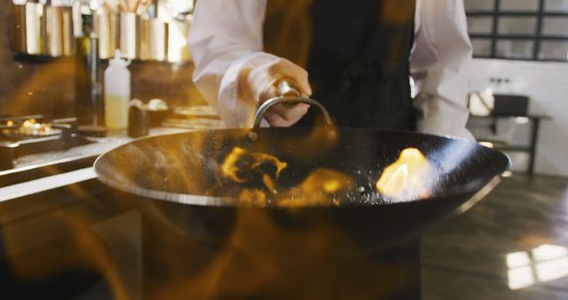 Chef Stir-frying Vegetables in Pan with Flames in Kitchen - Download Free Stock Images Pikwizard.com