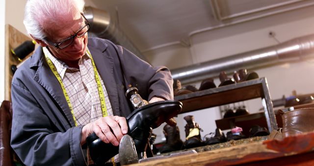 Senior Man Crafting Leather Shoe in Workshop - Download Free Stock Photos Pikwizard.com