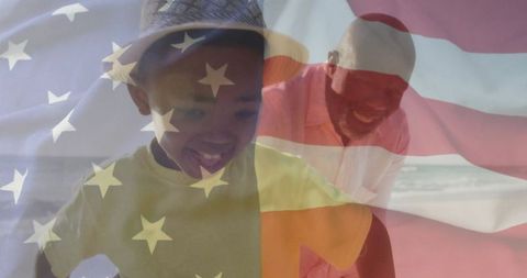 Joyful Father and Son on Beach with American Flag Overlay