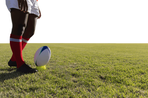 Transparent rugby player preparing kick on sunny field