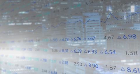 Digital Financial Data Overlaid on Cityscape at Dusk