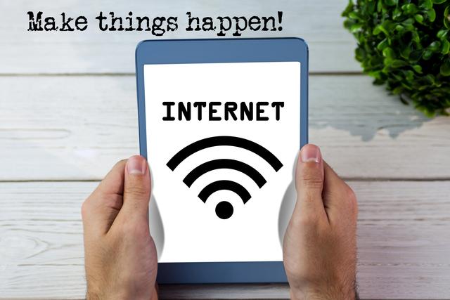 Tablet screen displays large internet and wifi symbol with 'Make things happen!' text above. Perfect for concepts around technology, connectivity, inspirational messages, online communications, remote work promotions, and digital lifestyle.
