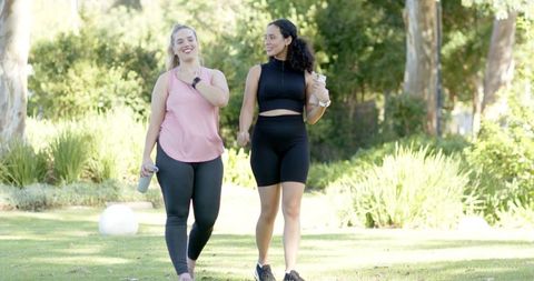 Diverse Women Enjoying Outdoors with Fitness Gear in Park