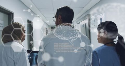 Innovative Medical Team Discussing Radiology in Hospital Corridor