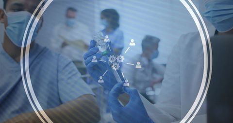 Healthcare team preparing vaccine syringe from vial with digital hud overlay concept