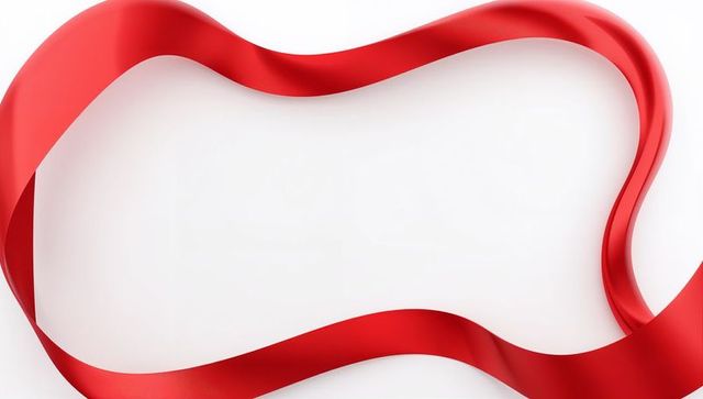 Flowing red satin ribbon looping across white background creating elegant minimalist frame