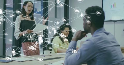 Professionals Discussing Analytics in Modern Office with Digital Network Overlay