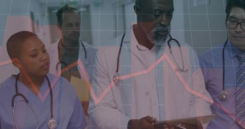 Medical team analyzing clinical data overlay on tablet, collaborating on patient metrics