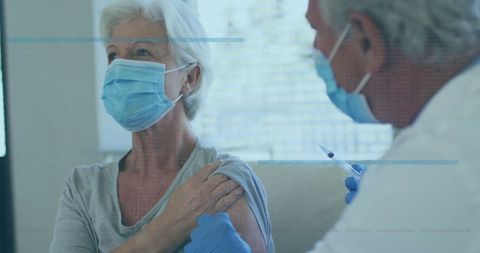 Senior Woman Receiving Vaccine by Healthcare Professional