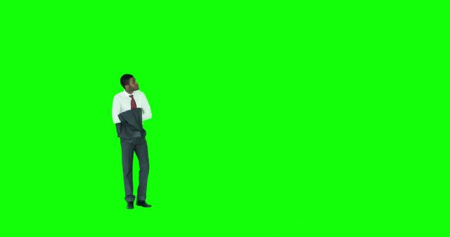 Businessman wearing a jacket on a green screen background. Useful for various business, corporate, and professional presentation themes. The green screen allows for easy background replacement, making it versatile for different purposes. Ideal for marketing materials, advertisements, or business articles.