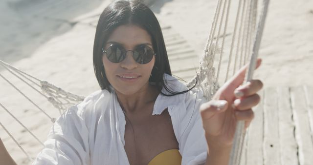 Smiling Woman Relaxing on Hammock at Beach - Download Free Stock Images Pikwizard.com