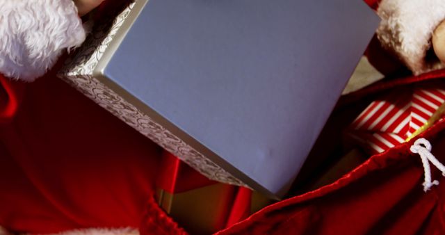 Santa Holding Gift Box during Christmas - Download Free Stock Images Pikwizard.com