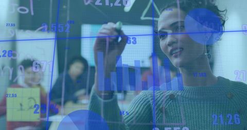 Businesswoman Analyzing Data on Glass Wall for Strategic Planning - Download Free Stock Images Pikwizard.com