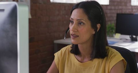 Customer support professional using computer