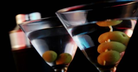 Elegant Martini Glasses with Olives in Upscale Bar Ambiance - Download Free Stock Images Pikwizard.com