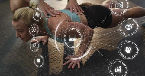 Female athlete performing assisted push-up while trainer coaching using ar data hud
