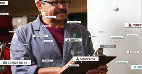 Technician analyzing data on clipboard in high-tech workshop