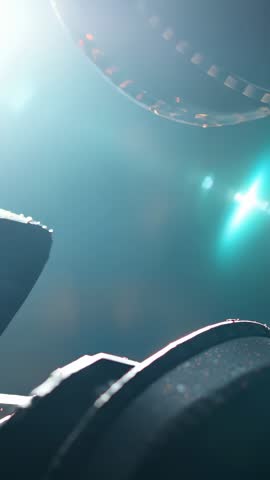 Drifting filmstrip catching cinematic light with perforations, reel edges, and lens flare