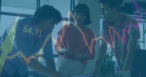 Team Analyzing Financial Data Visualization in Office Environment