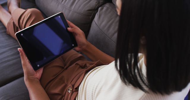 Woman Relaxing on Couch with Tablet at Home - Download Free Stock Images Pikwizard.com