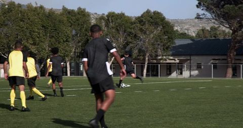 Youth soccer practice with teamwork and skill development